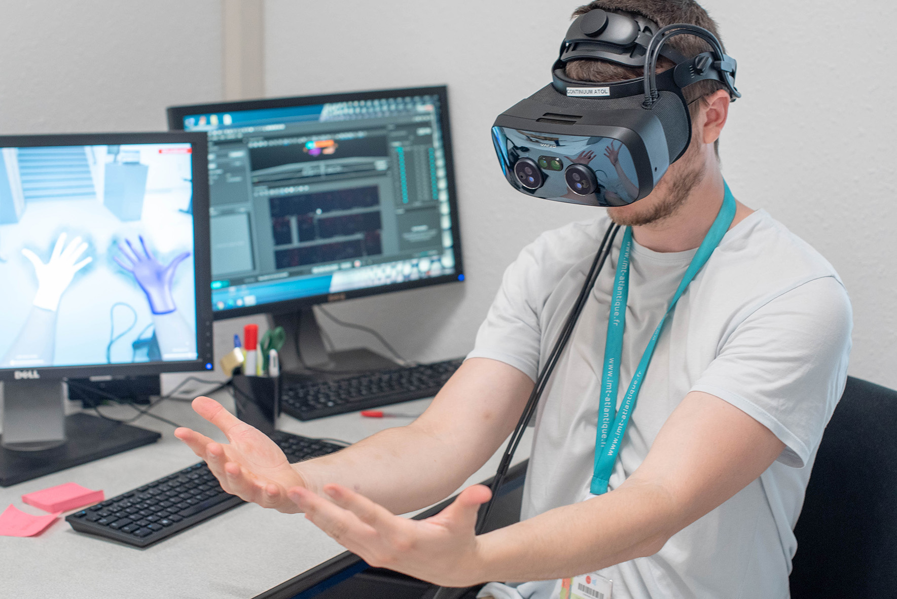 A participant testing a mixed-reality prototype at a CEXI-HA workstation